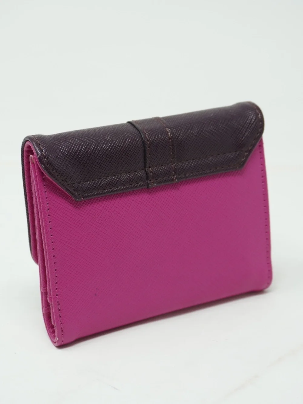 Cute small purple and pink bifold wallet features a textured finish